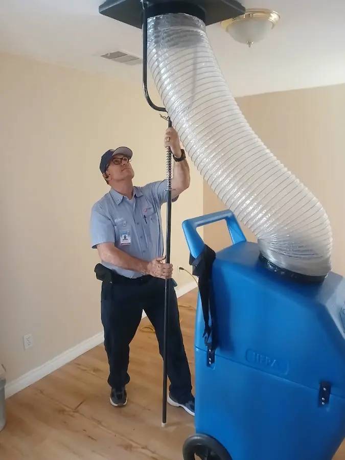 HVAC Installation technician using HEPA equipment in Blanchard